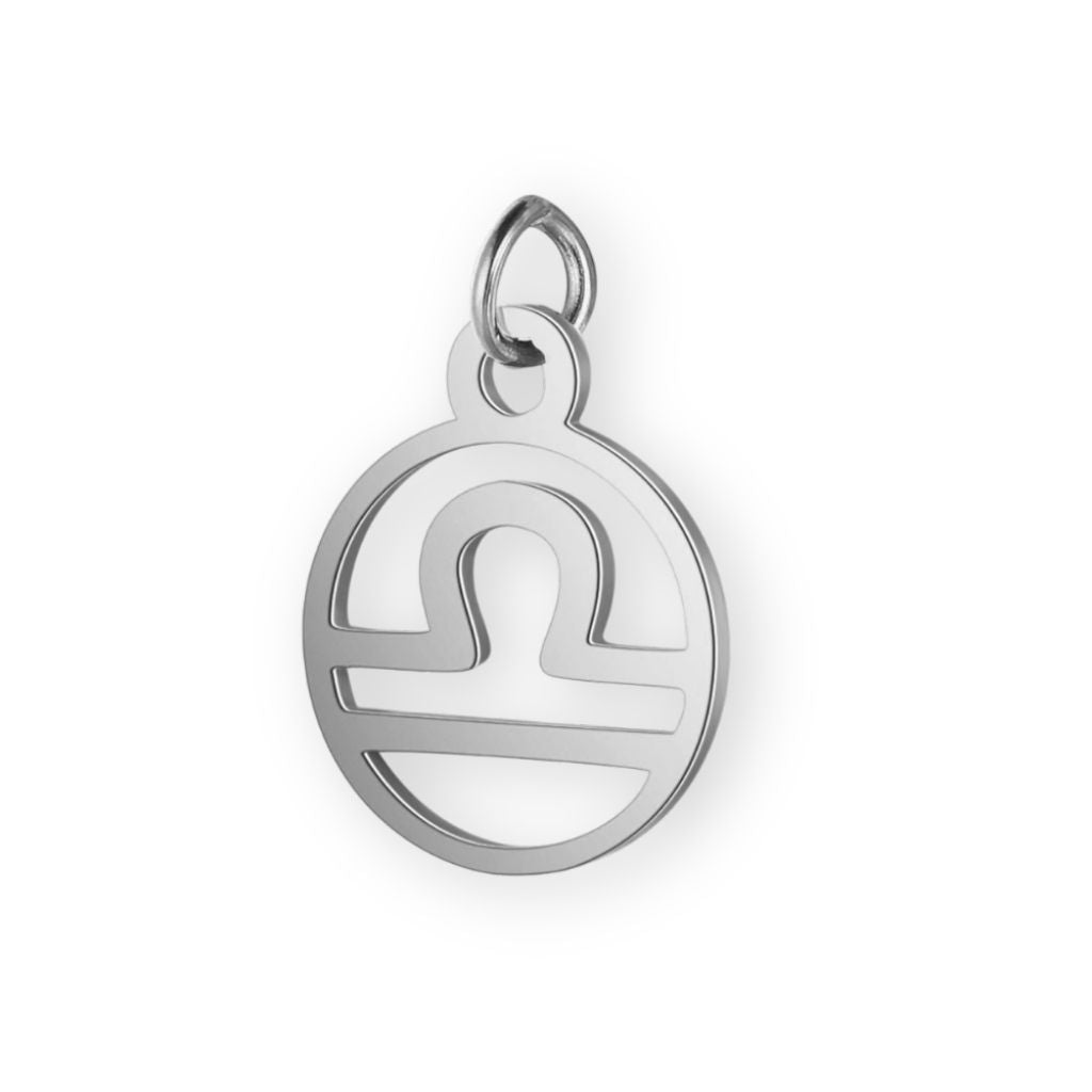 Un pendentif en argent pour bola de grossesse de femme enceinte représentant le signe astrologique de la balance