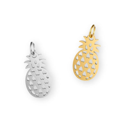 Une collection de pendentif ananas en argent et en or pour bola de grossesse de femme enceinte