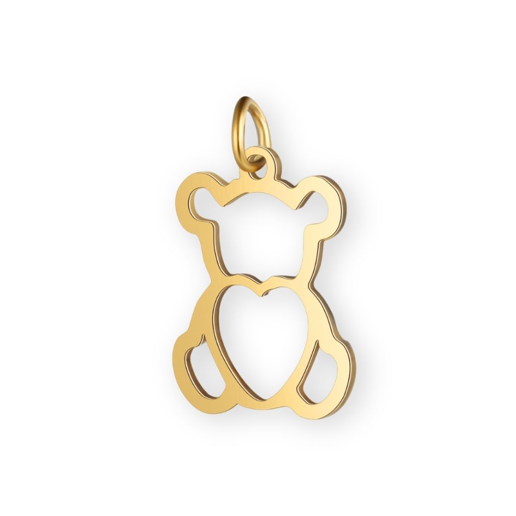 Une collection de pendentif nounours en or pour bola de grossesse de femme enceinte