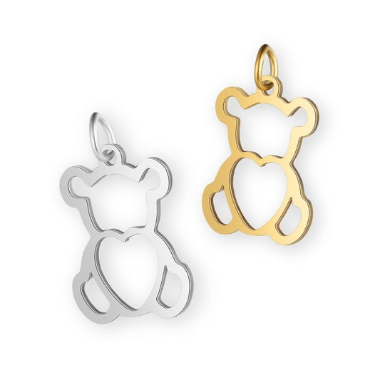 Une collection de pendentif nounours en argent et en or pour bola de grossesse de femme enceinte